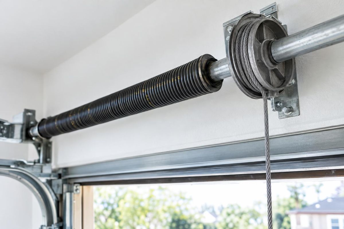 Garage Door Springs Explained: Torsion vs. Extension